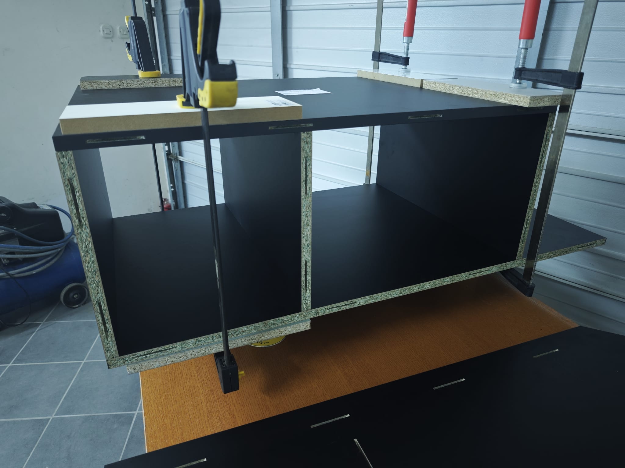 Assembled base section of the dartR Vulcano cabinet in the garage