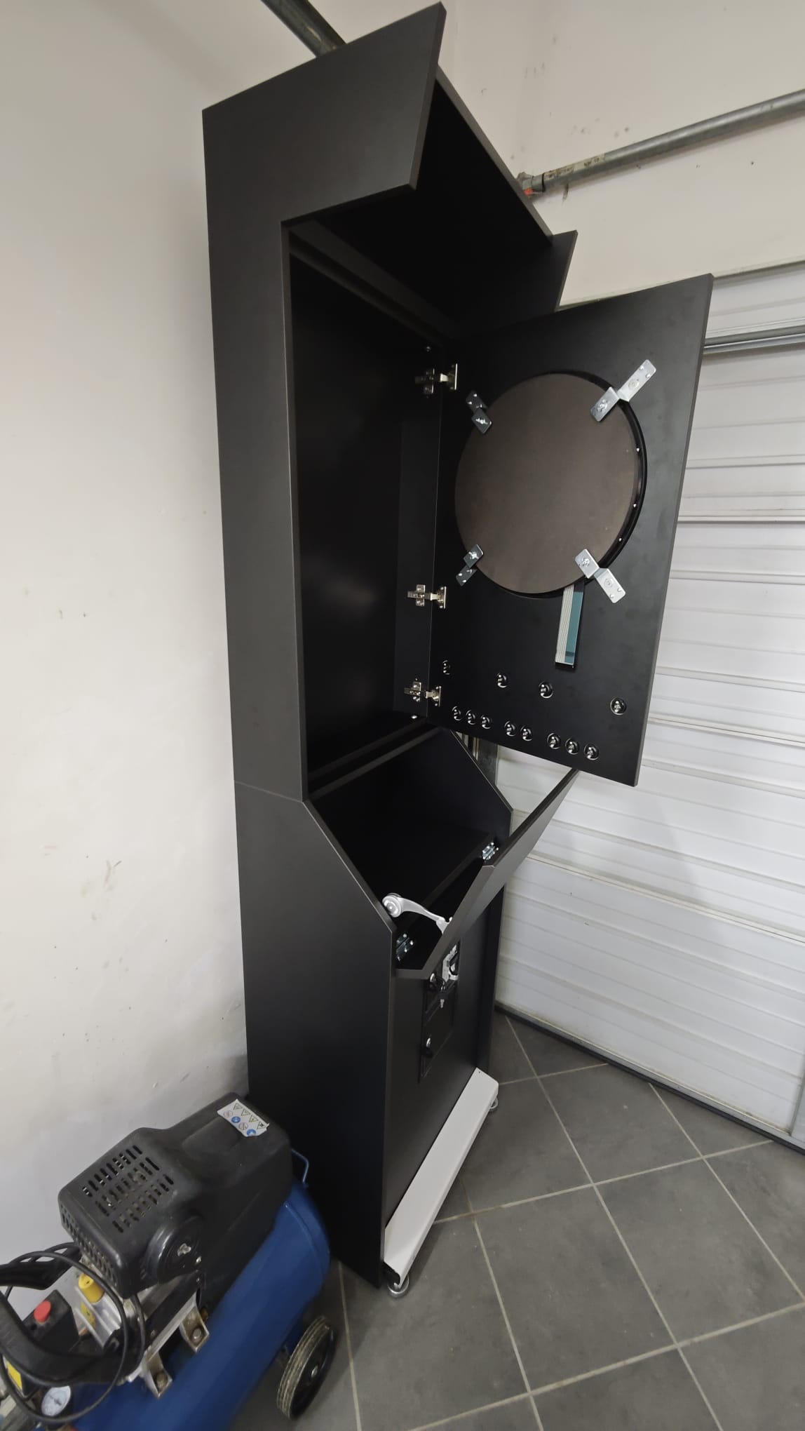 Vulcano dartboard section door open showing the dartboard and buttons mounted from behind